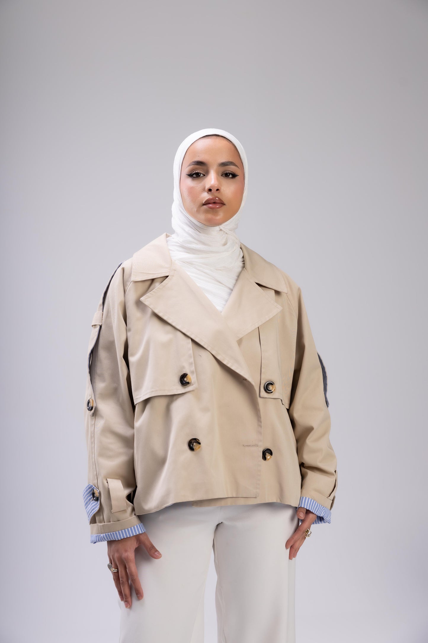 Beige trench with blue stripped sleeve cuff