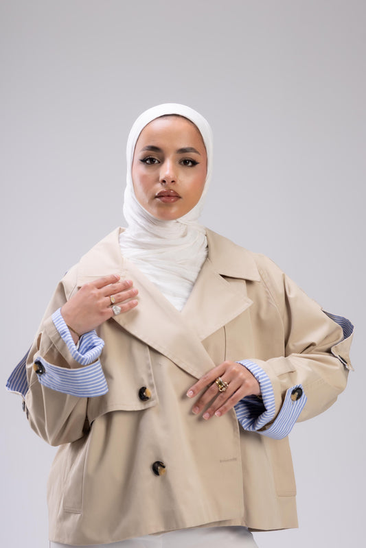 Beige trench with blue stripped sleeve cuff