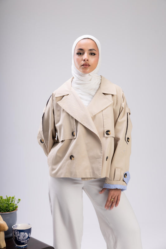 Beige trench with blue stripped sleeve cuff